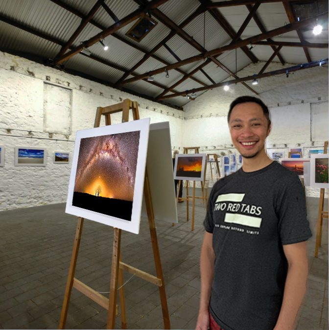 Stanley beside his own print, exhibited. This is the thing the week is for.